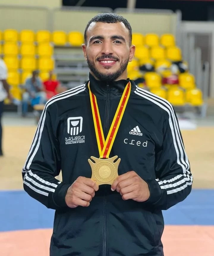 Mohamed Ibrahim Kishu is crowned with a gold medal in wrestling at the African Games