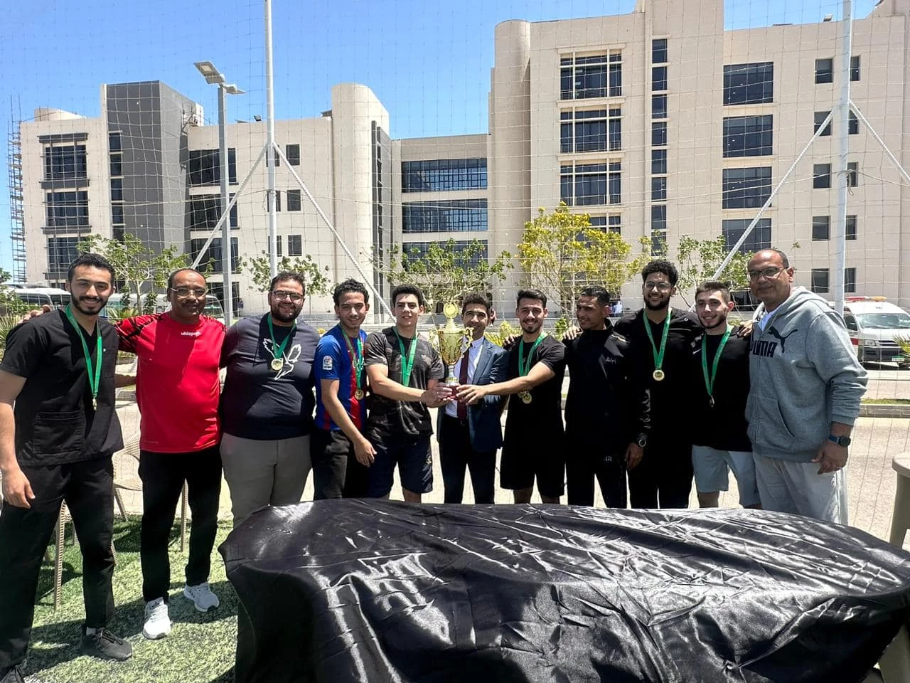 Celebrating the students who won the five-way football league at the Al-Alamein branch.2