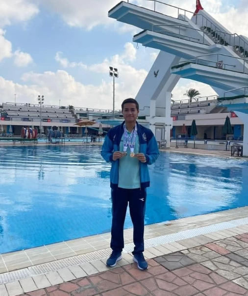Congratulations from the president of the academy to our hero, the son of the Academy (Adham Magdy Mahmoud Ismail), a swimming and diving star enrolled in the Faculty of human medicine, Alamein branch
